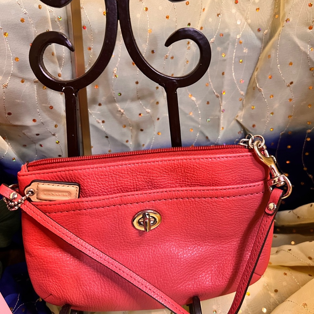 Coach Park Leather Medium Wristlet Sienna Coral" or "Tearose Coral".